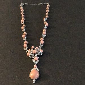 Necklace in silver with bright peach accents interspersed with rhinestones